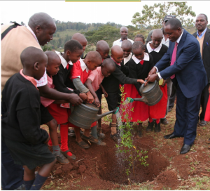 Technical Assurance & Quality, Manager Henry Ithiami planting a Tree at Nalepo Pri Sch Ngong II. Giving back to the environment. with one message – Be a Giver.