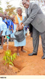 The KenGen Foundation, managing  trustee Mike Njeru teaching pupils  how to care for the environment. 